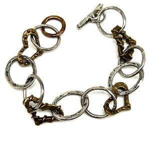 153. Estate Find! Unsigned Kenneth Cole sliver bronze tone heart bracelet.